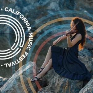 woman on rocks in black dress playing violin - cmf